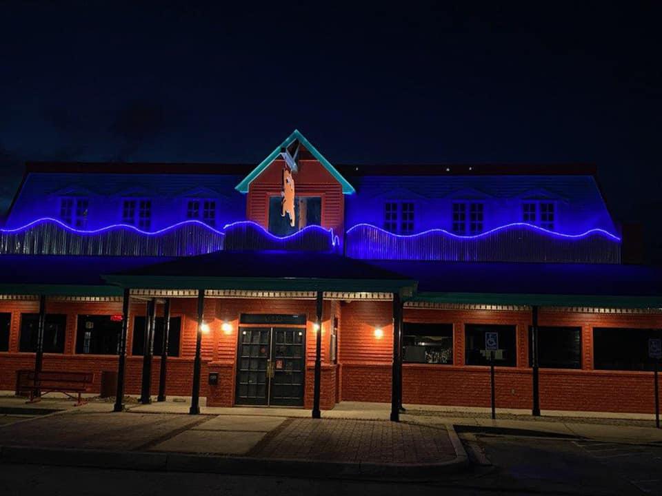 Exterior of the Crab Shack Crofton building at night