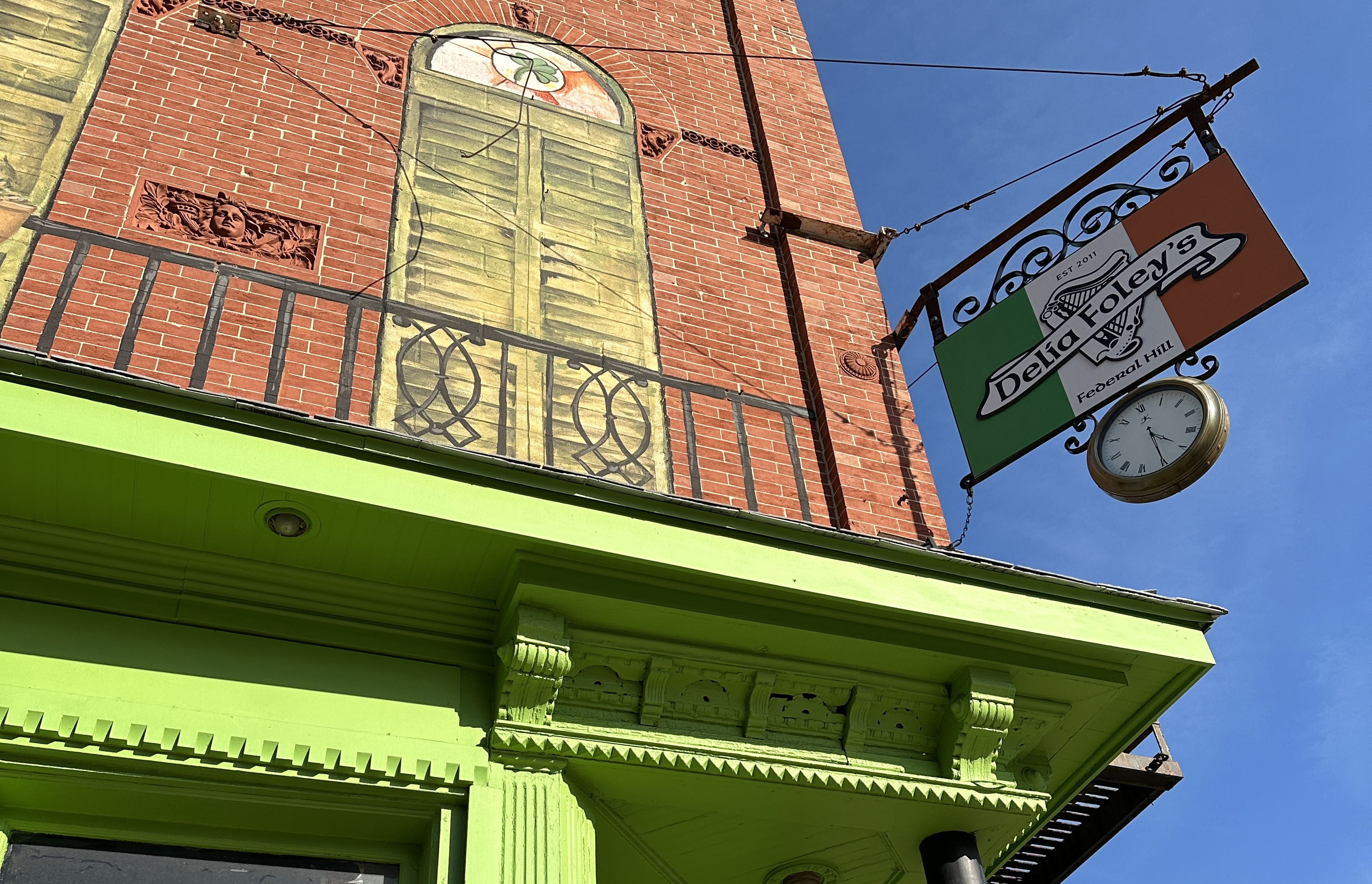 Exterior of the Delia Foley's building, with a sign of the logo and Irish flag