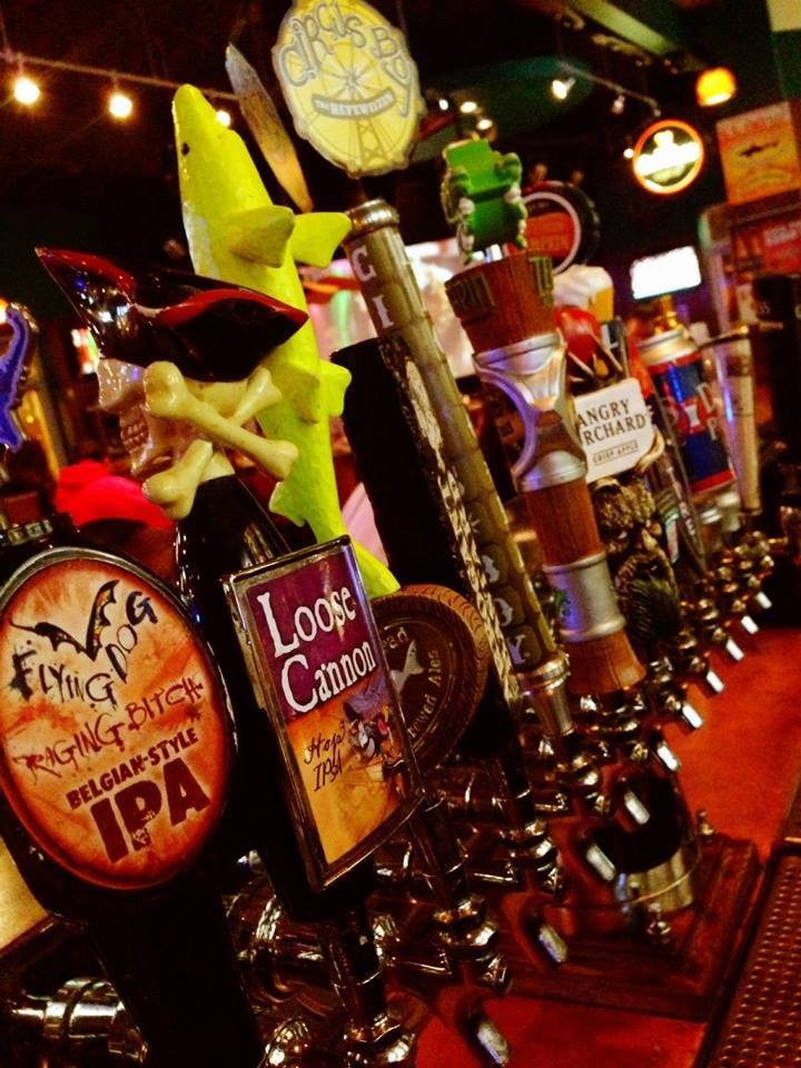 a row of beer taps