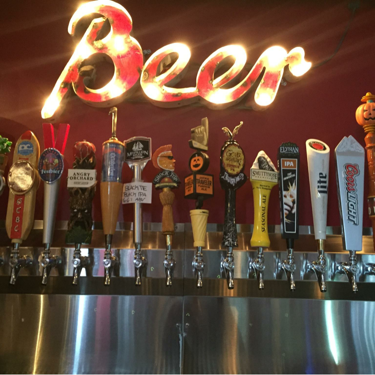 a row of beer taps