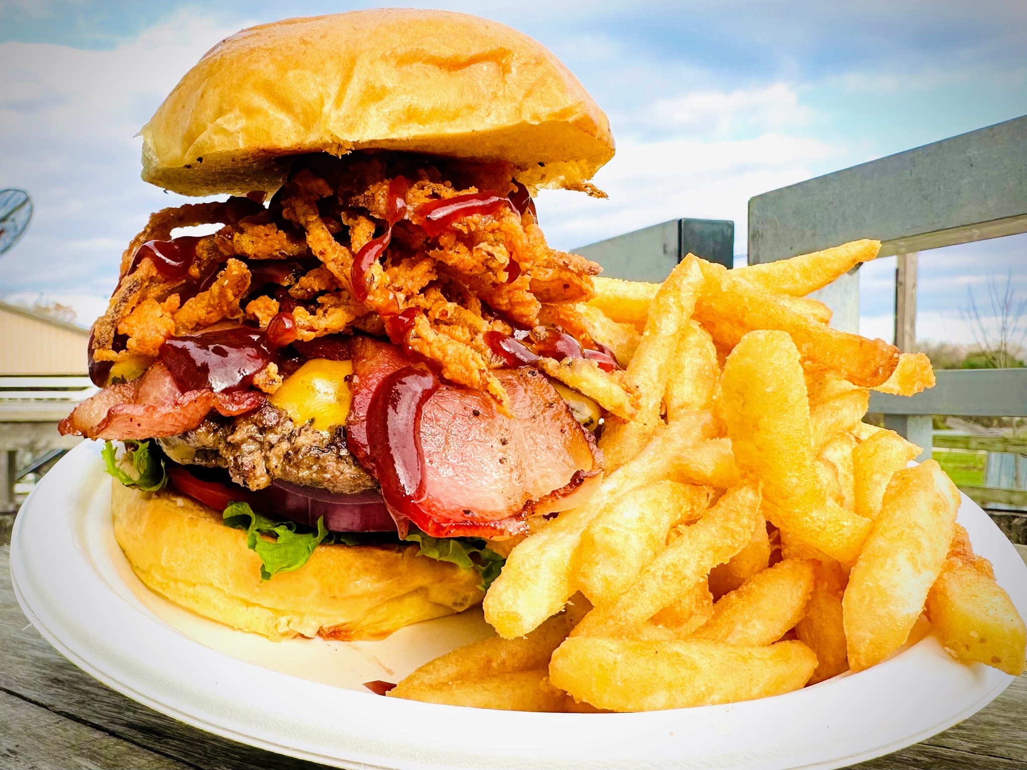 A cowboy burger with fries