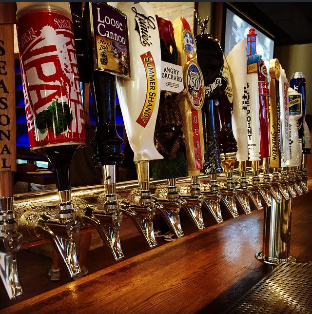 a row of beer taps