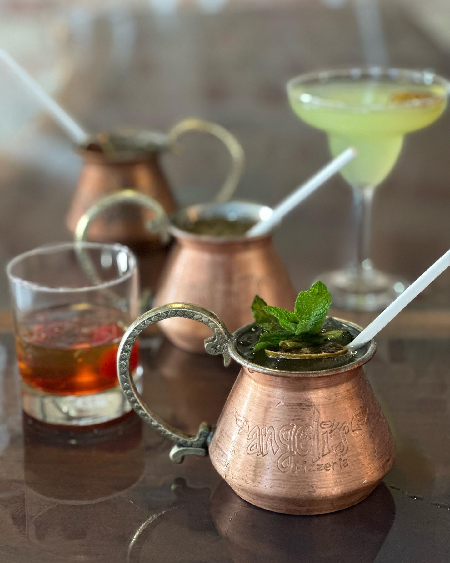 five cocktails on a table