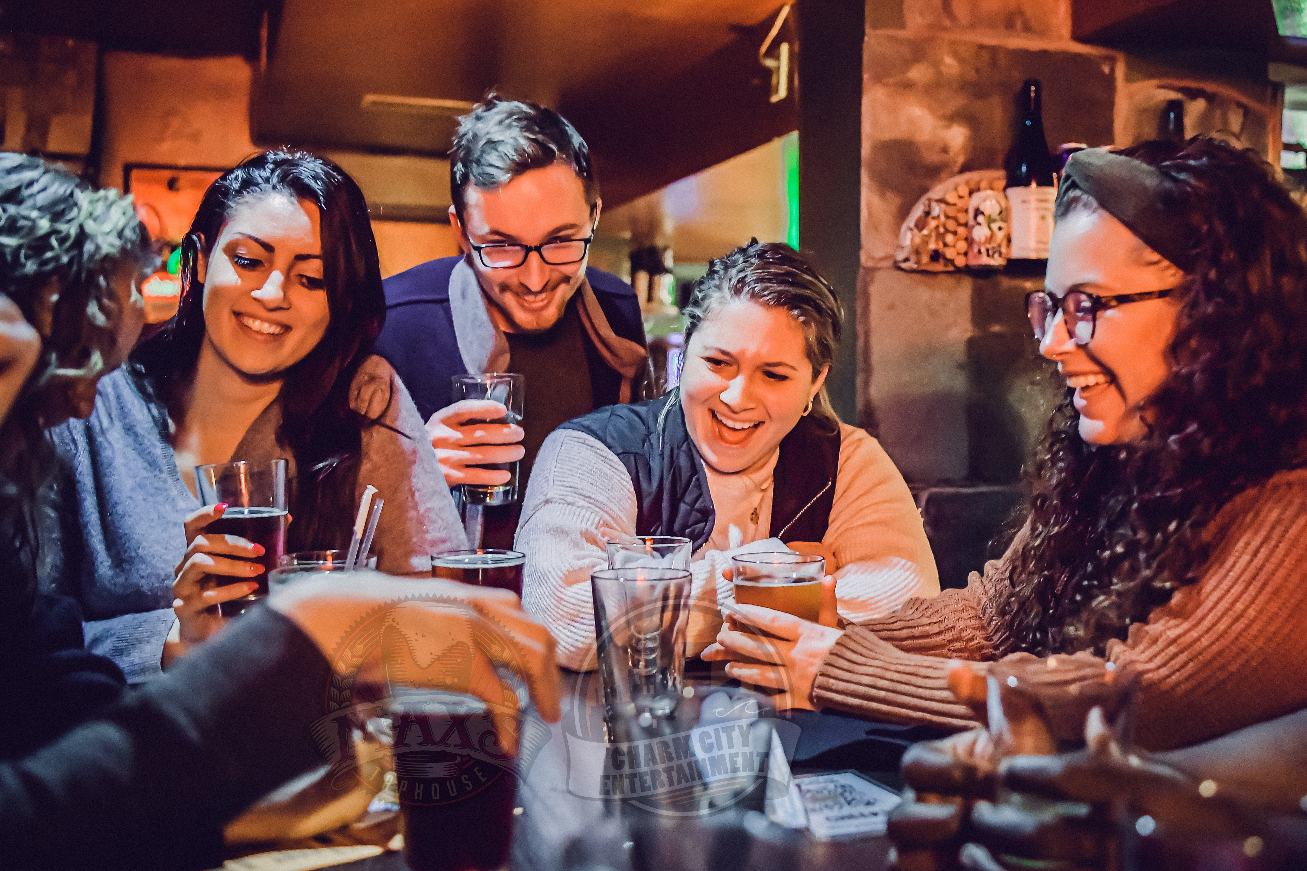 a group of friends sitting around a table