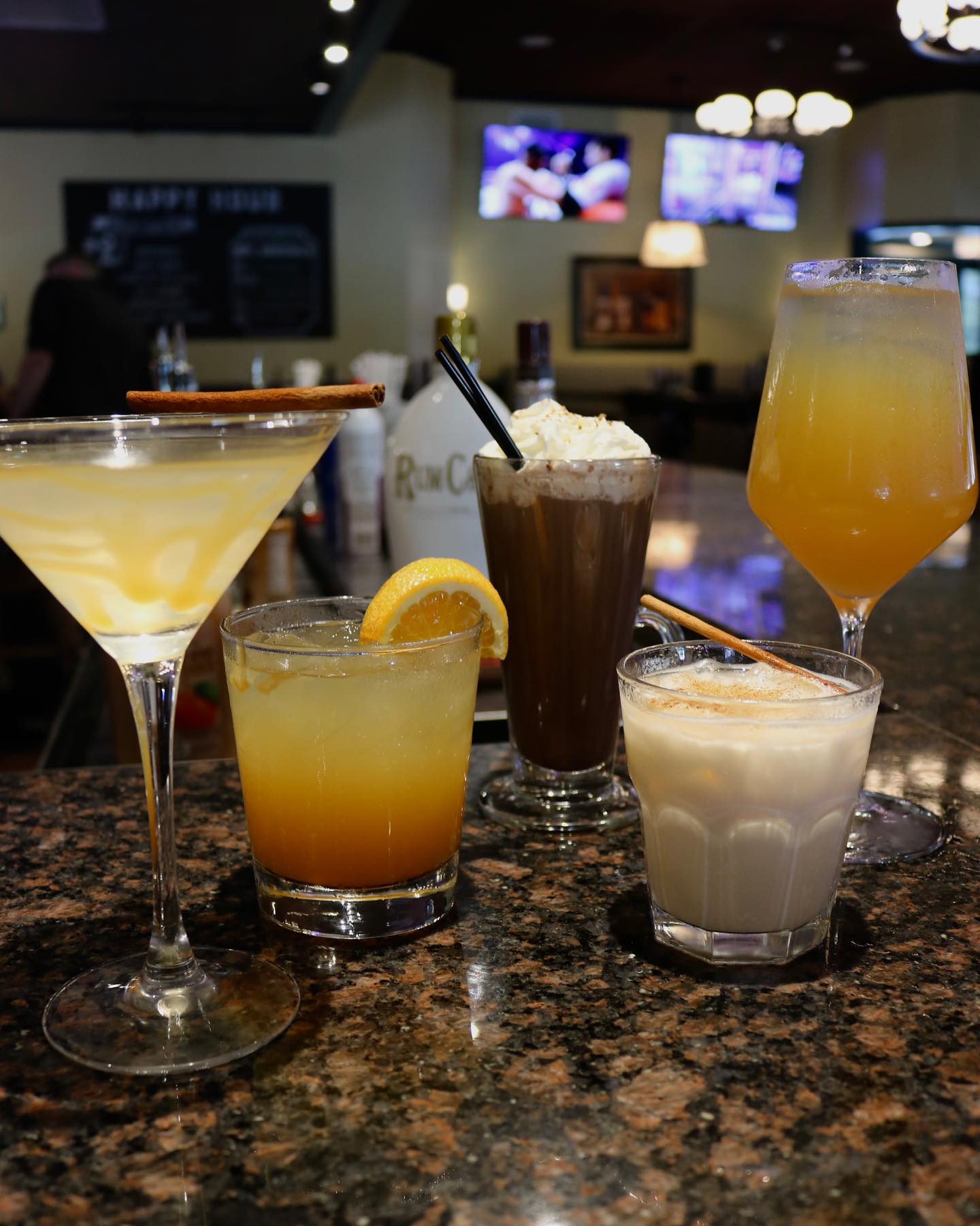 five cocktails on a table