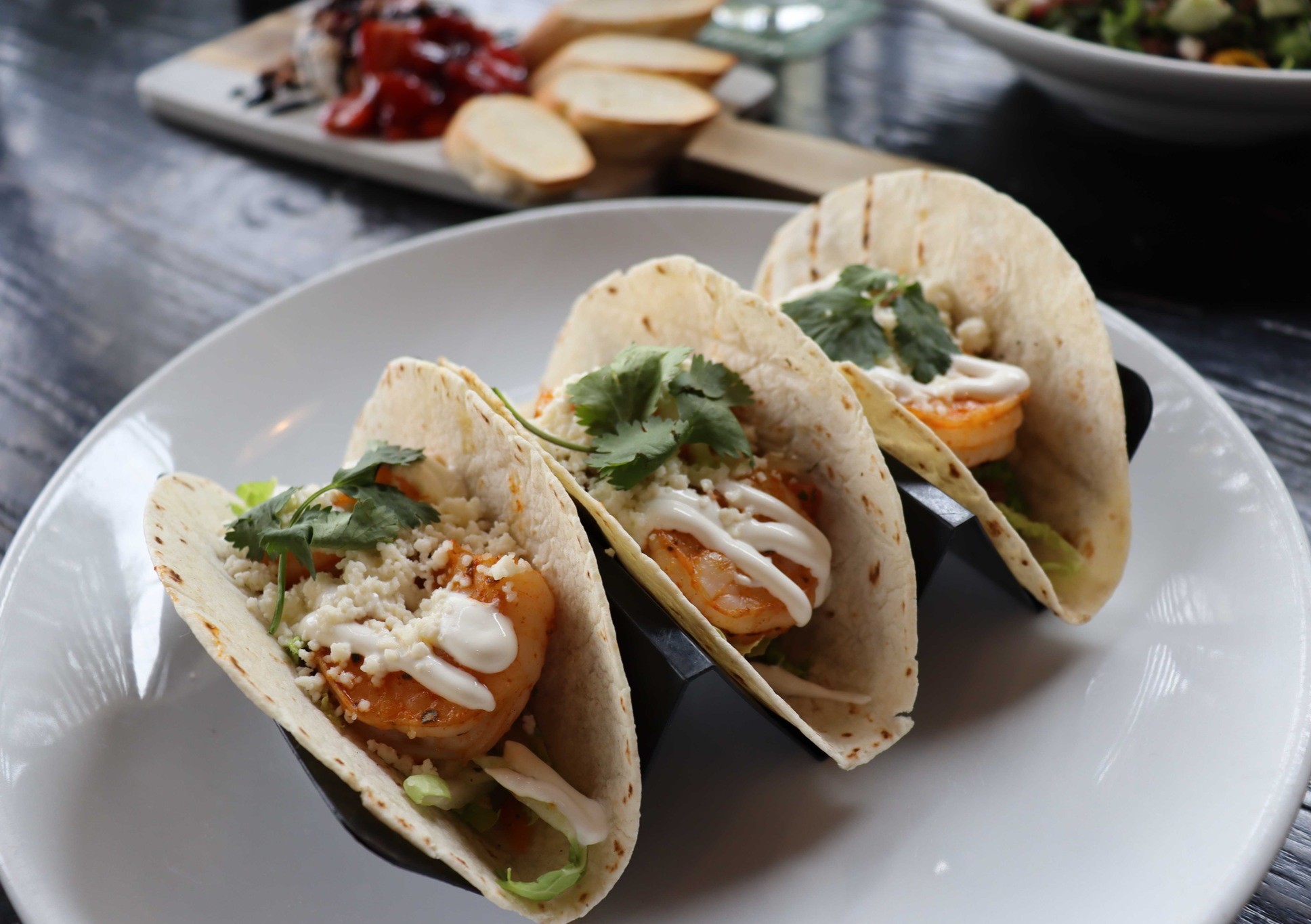 a plate of three fish tacos
