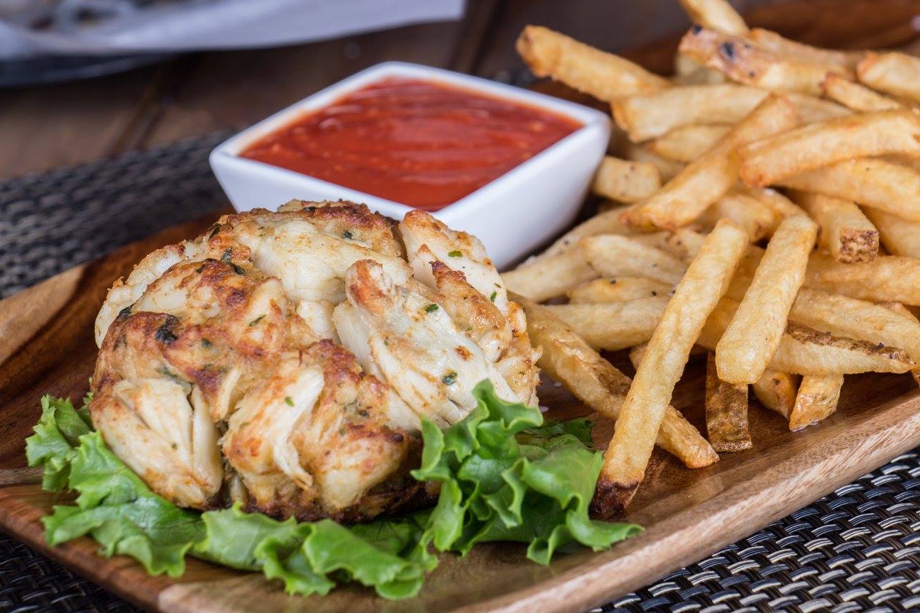 a crab cake with fries