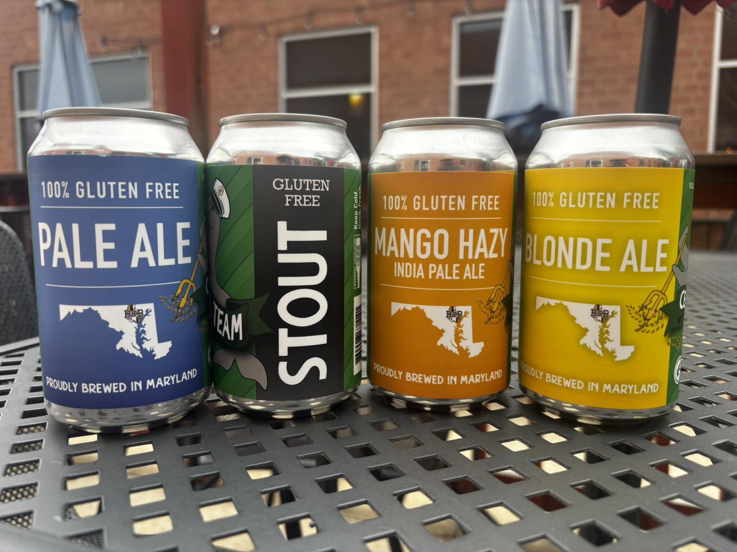 four gluten free beer cans on a table