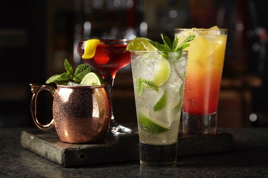 four different cocktails on a table