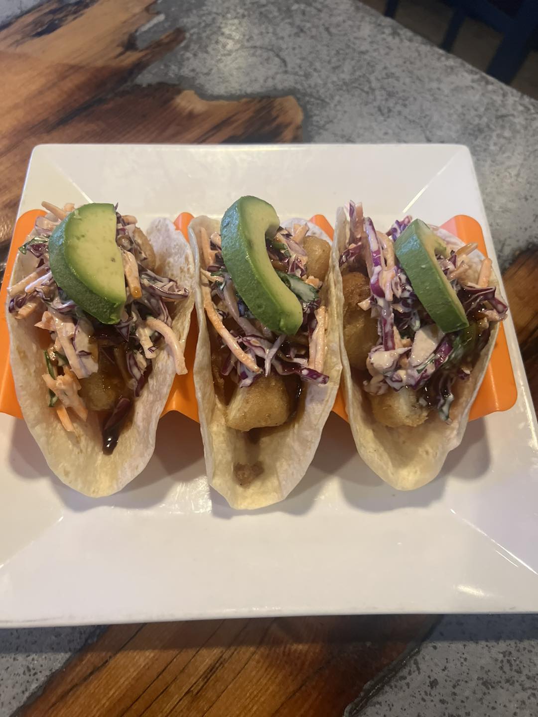 three tacos on a plate
