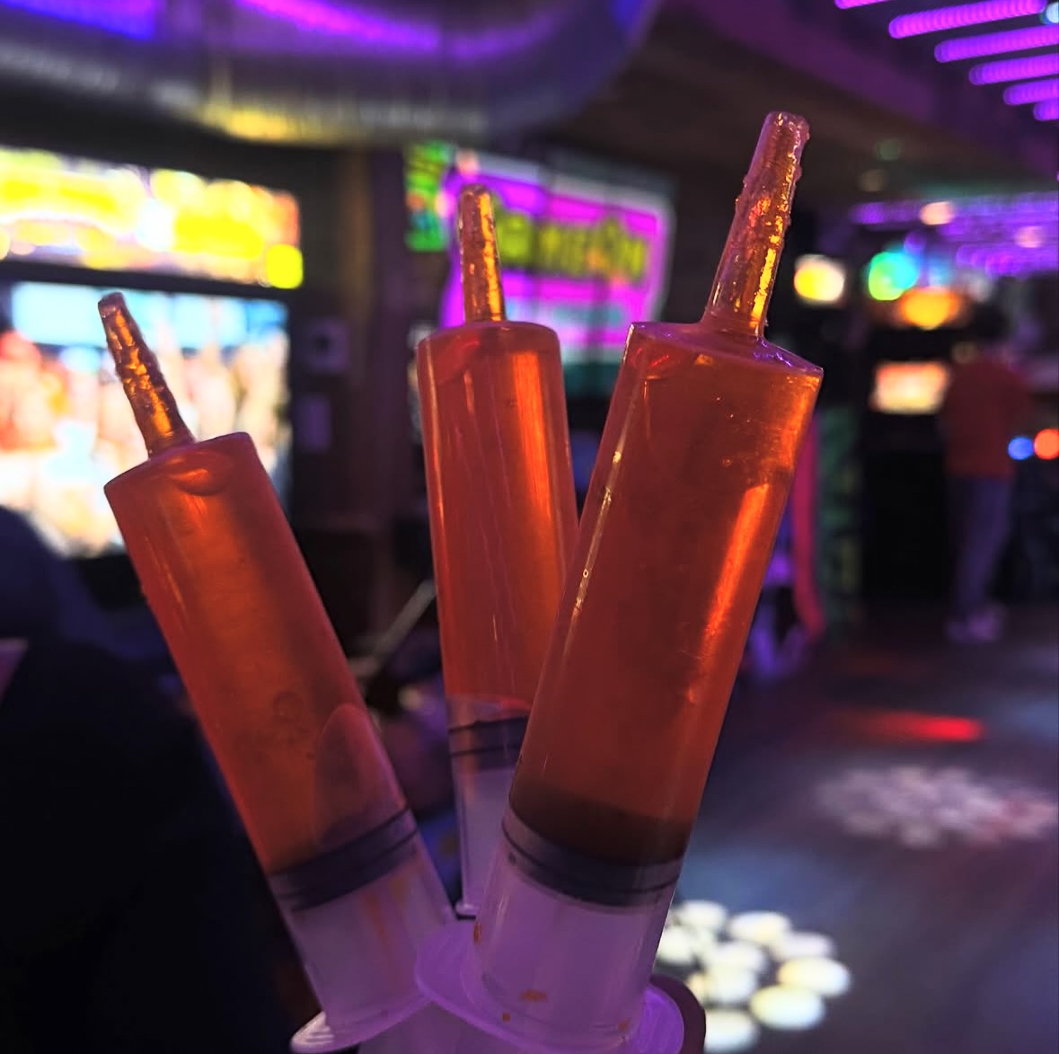 three jello shots in syringes