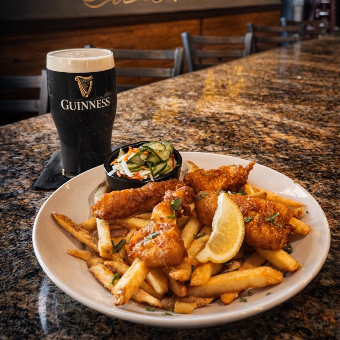 a plate of fish and chips and a glass of beer