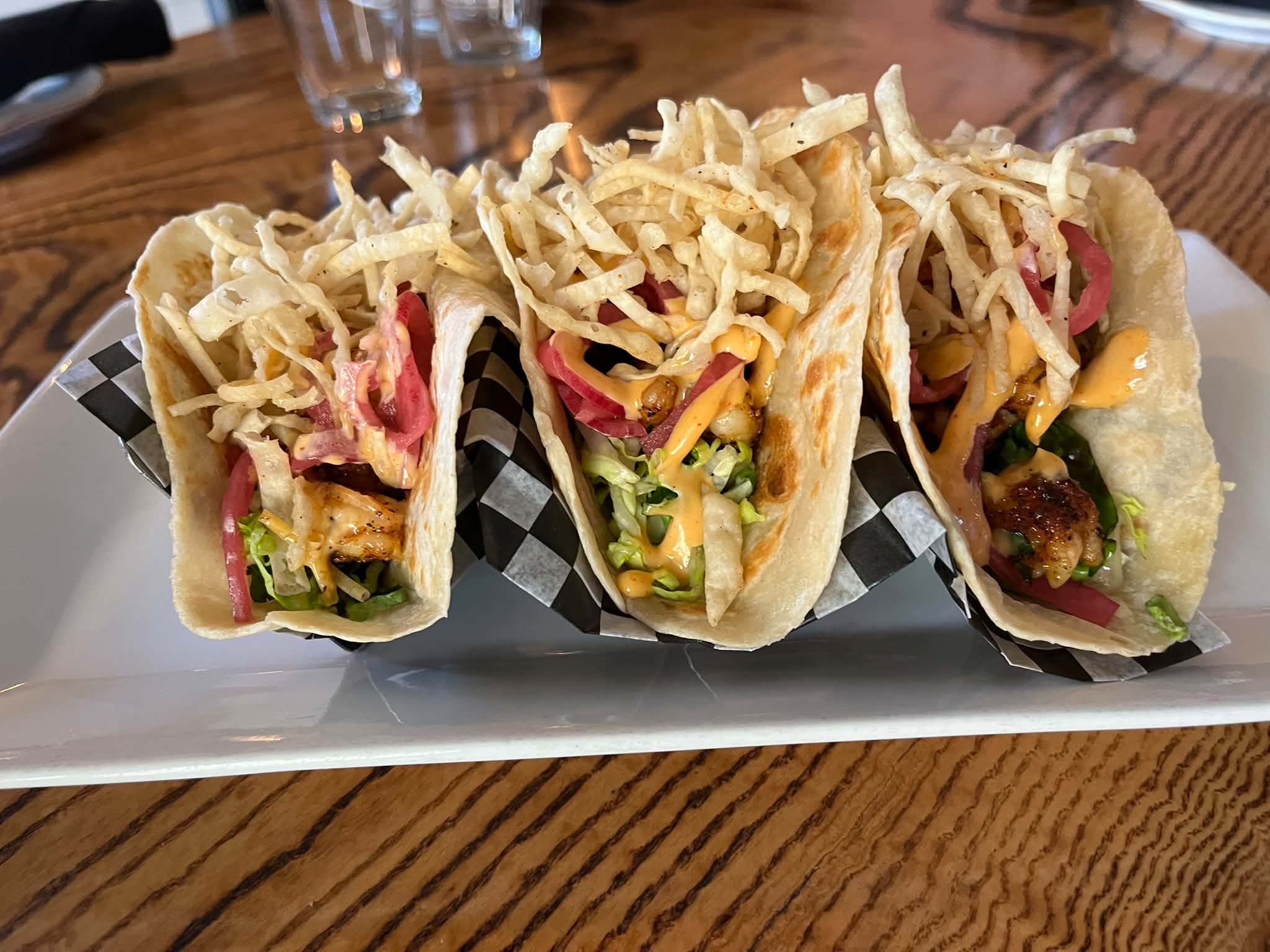 a plate of three tacos