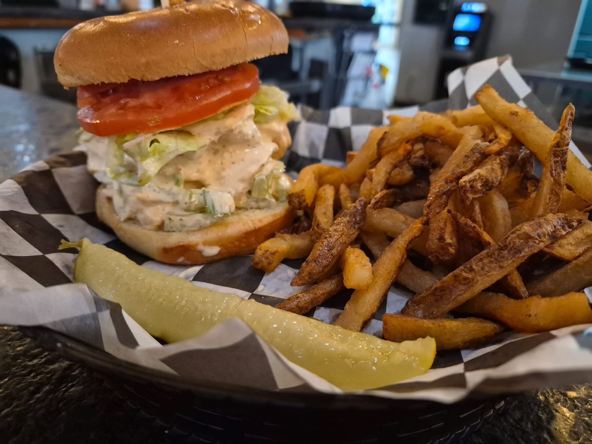 a shrimp salad sandwich with fries