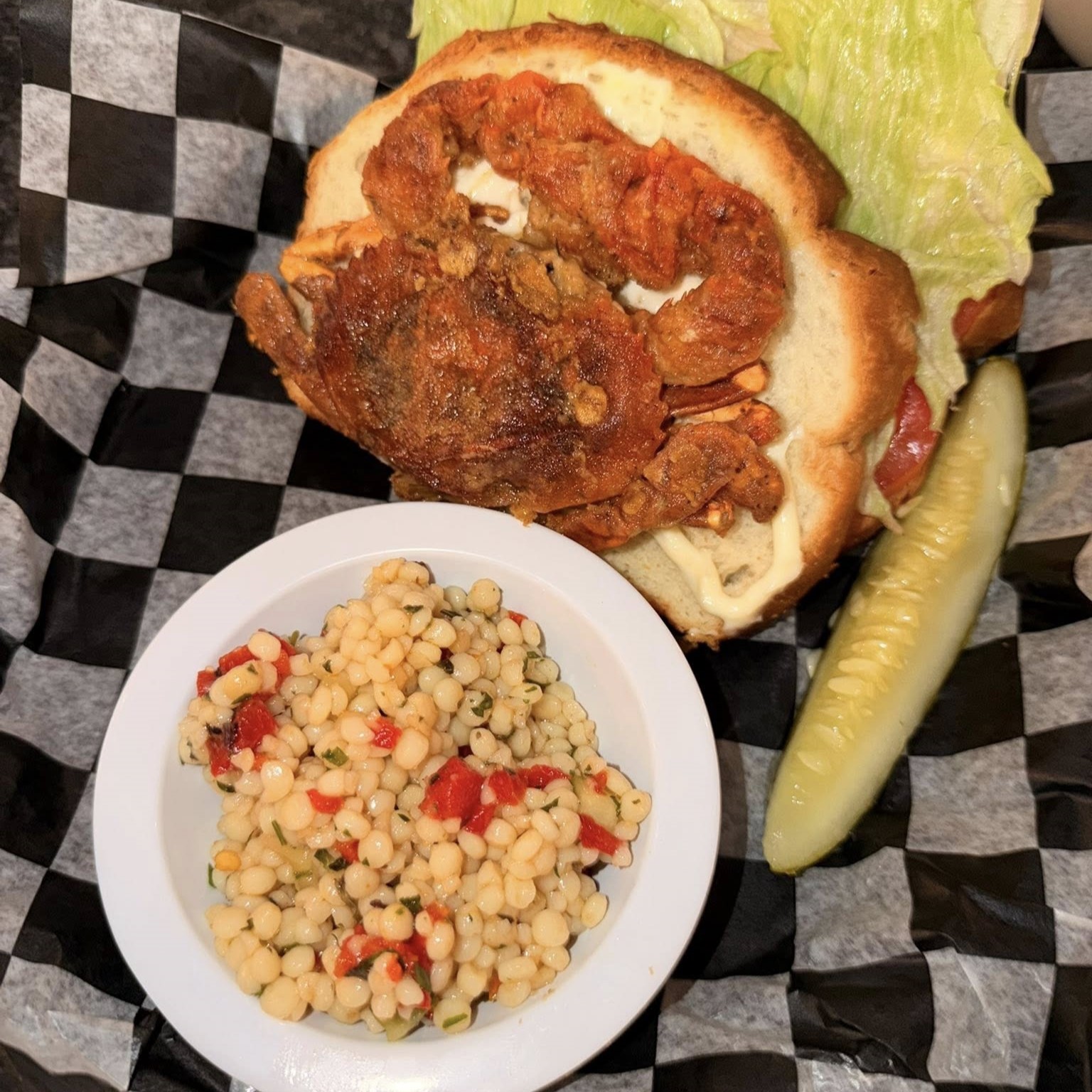 a soft crab sandwich with corn salsa