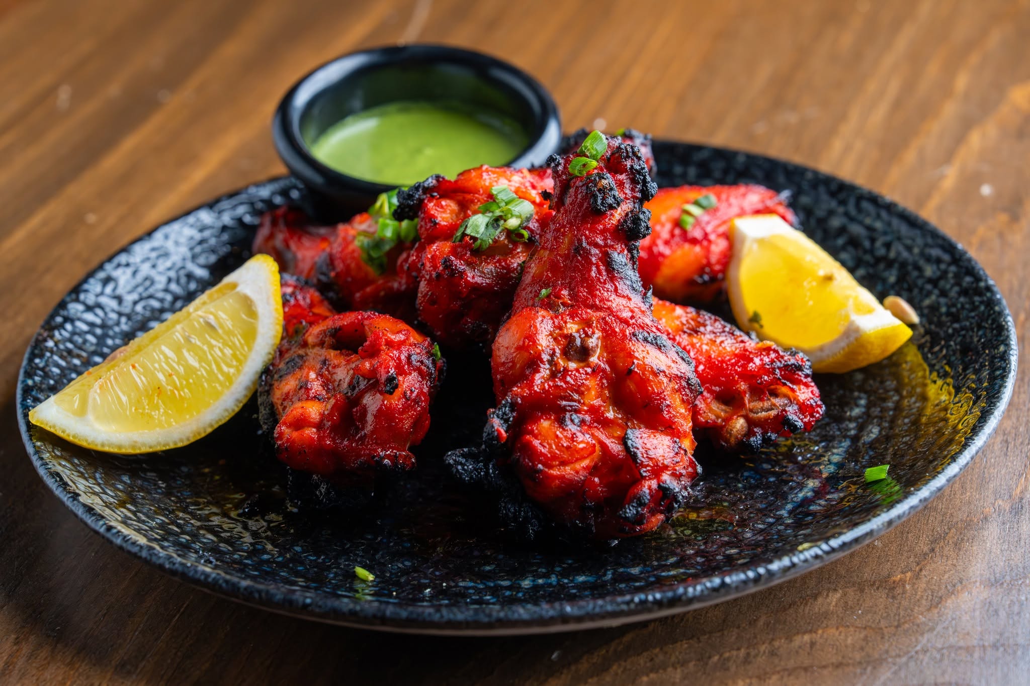 a plate of Tandoori chicken wings