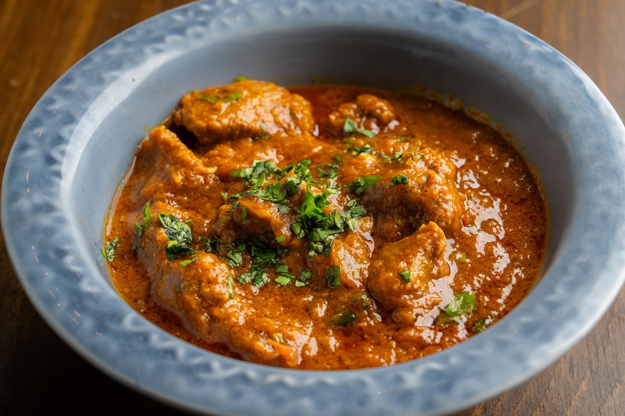 a bowl of chicken tikka masala
