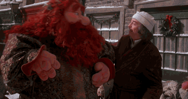 a gif of Scrooge and the Ghost of Christmas Present from The Muppets: A Christmas Carol dancing